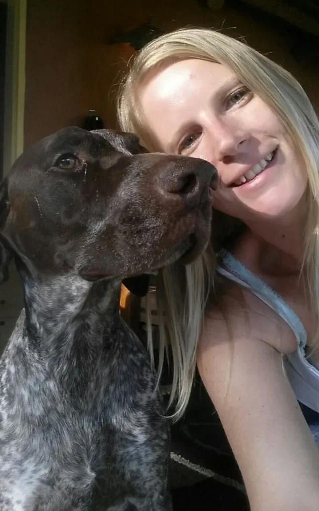 photo of blond women and a german shorthair pointer